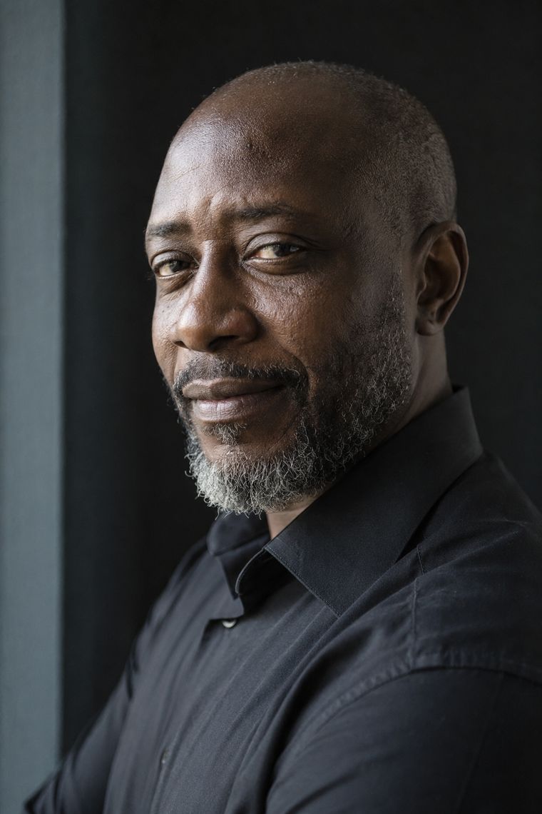 A man with deep skin and visible texture