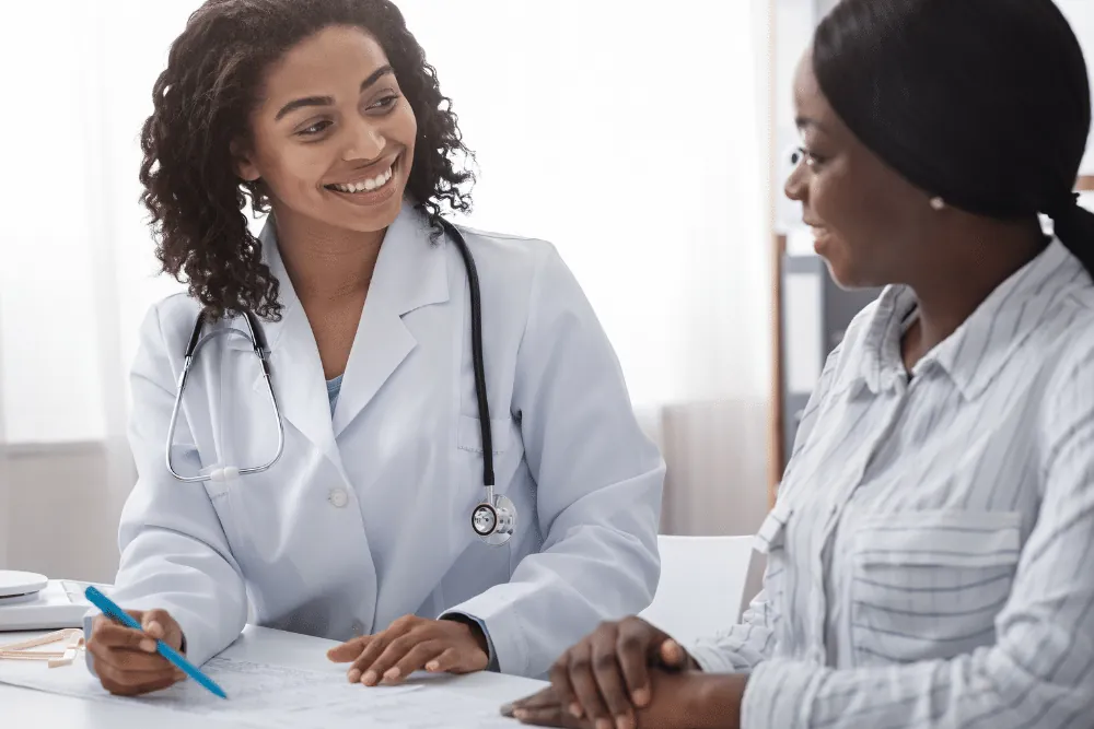 doctor explaining skin tightening for African-American skin in DC