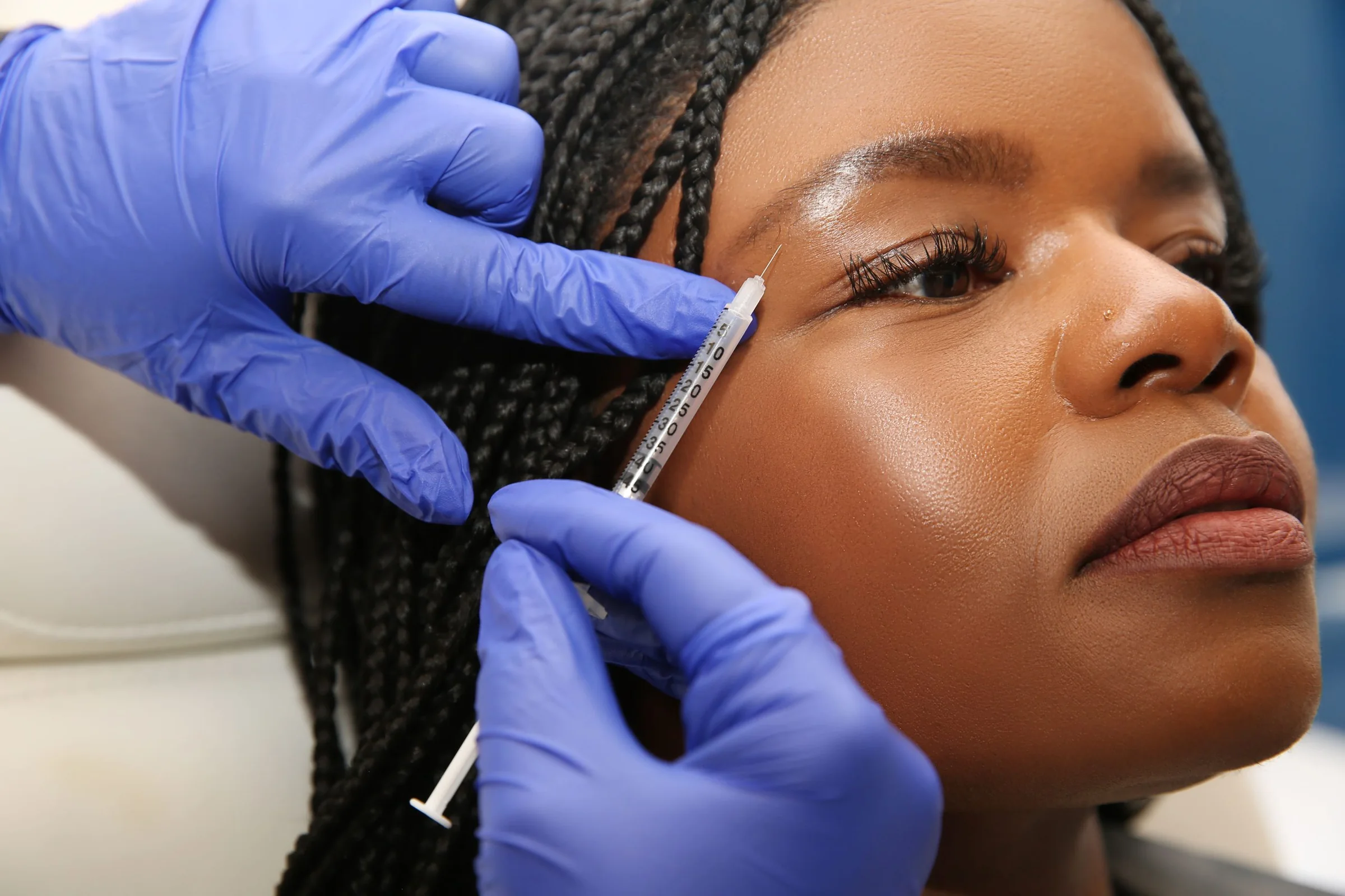 A Capital Aesthetic injector treating deep, melanin-rich skin