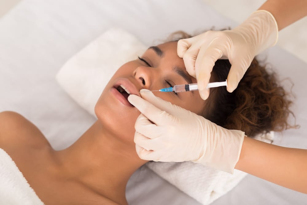woman trying the best lip filler for black women in DC